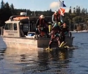 diver steps off boat into Eagle Harbor